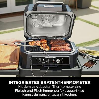 Ninja Woodfire Pro Connect XL Elektrischer BBQ Smoker Grill, App-Steuerung, digitaler Temperaturfühler, Rippenrost, Deckel, großer 7-in-1 Outdoor Grill & Heißluftfritteuse, blau & schwarz OG901EUAMZ